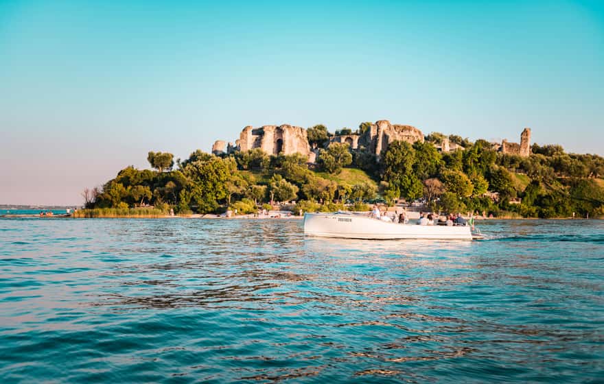 Tour boat on open water off the Sirmione peninsula, Lake Garda